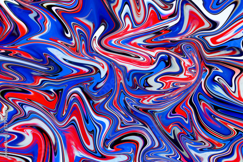Fototapeta Naklejka Na Ścianę i Meble -  Red, white and blue liquid marbling paint swirls background. Fluid painting abstract texture.