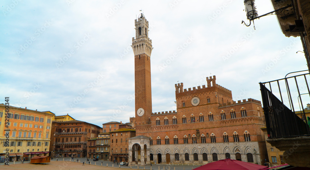 details of the tower del mangia in siena italy