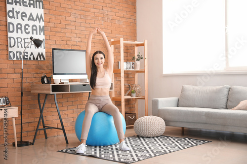 Woman doing exercises with ...
