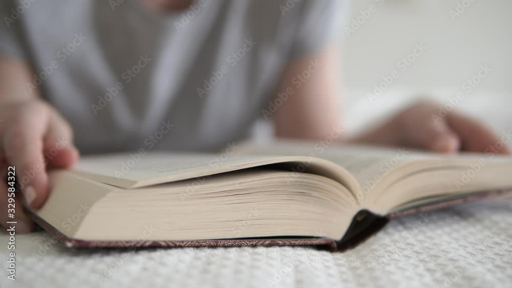 Girl laying on bed, reading and closed book, learning, studying, education, time with book. Girl laying on bed, reading and closed book, learning, studying, education, time with book.