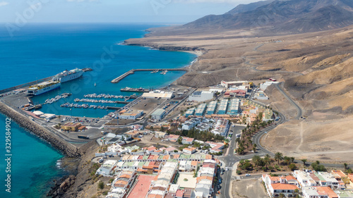 Morro Jable Canary Island, Fuerteventura Spain, Aerial view on coast of atlantic ocean and beach, Drone shot of sea 