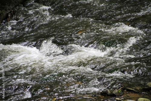  fast flowing and splashing water of the mountain river