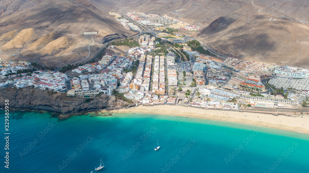 Morro Jable Canary Island, Fuerteventura Spain, Aerial view on coast of atlantic ocean and beach, Drone shot of sea 