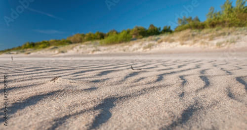  Sandy beach on a sunny day © atostogos13