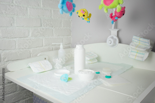 changing table and baby care products-powder, cream, pacifier, diapers