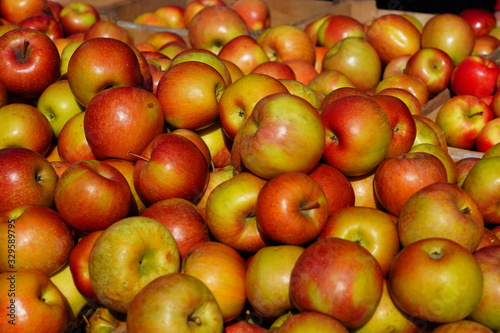 Fresh red and yellow apples at a farmers market