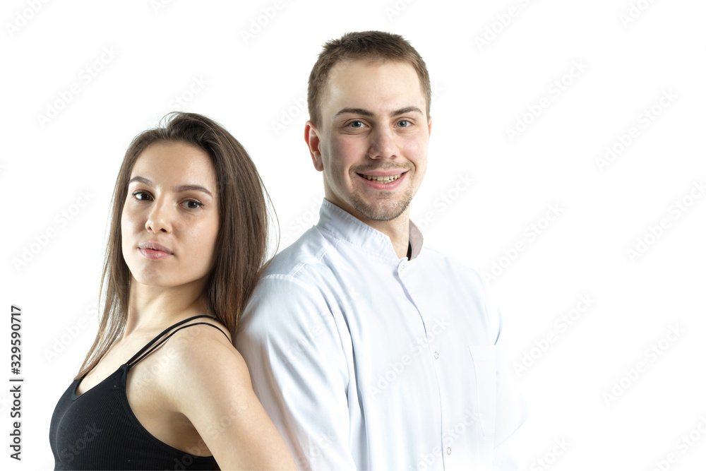 Portrait of a fitness girl and her doctor on a pure white background. Isolate Portrait of a fitness girl and her doctor on a pure white background. Isolate