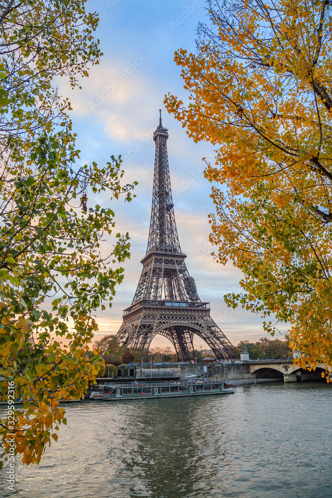 Eiffel tower in Paris France on an autumn day surrounded by trees, Tour Eiffel in the fall