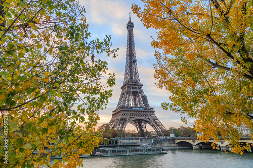 Eiffel tower in Paris France on an autumn day surrounded by trees, Tour Eiffel in the fall © JeanLuc Ichard