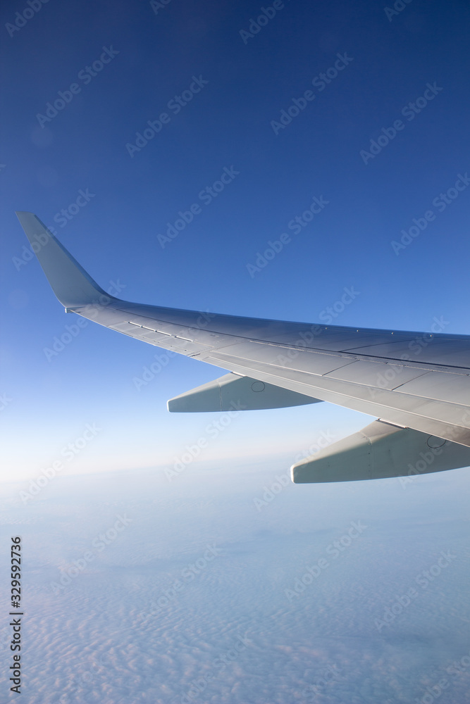 Airplane wing in the sky. View from a great height. Airplane wing in the sky. View from a great height.