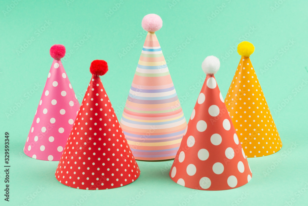 Colorful birthday caps on mint background. Colorful birthday caps on mint background.