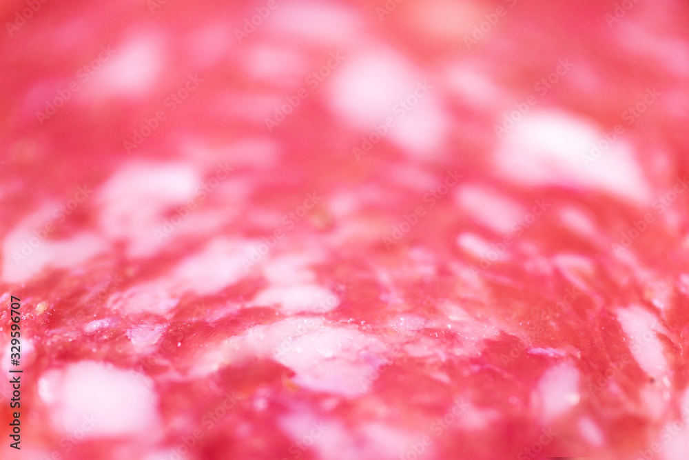 Texture of a smoked salami sausage macro background