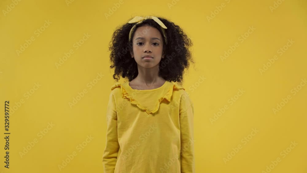 african american kid showing no gesture isolated on yellow