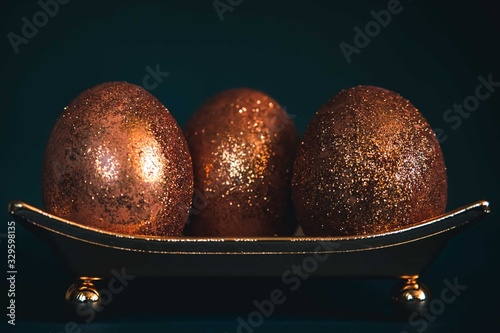 golden decorated easter eggs photo