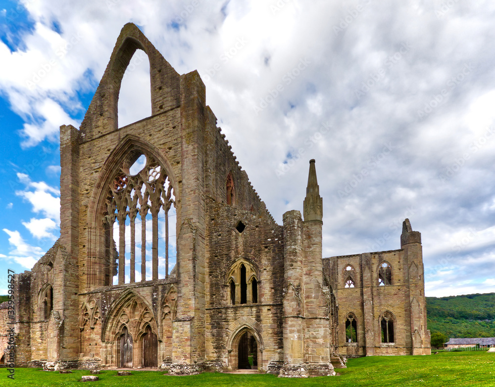 Fototapeta premium The ruins of Tintern Abbey, founded by Walter de Clare, Lord of Chepstow, on 9 May 1131. It is situated adjacent to the village of Tintern in Monmouthshire, Wales, UK.