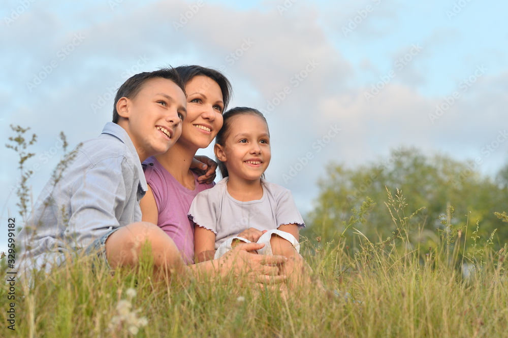 Portrait of happy mother and children in park Portrait of happy mother and children in park
