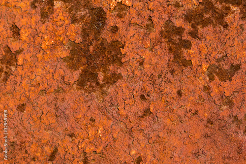 Corroded rusty texture of metal. Scratched and spotted rusty metal background