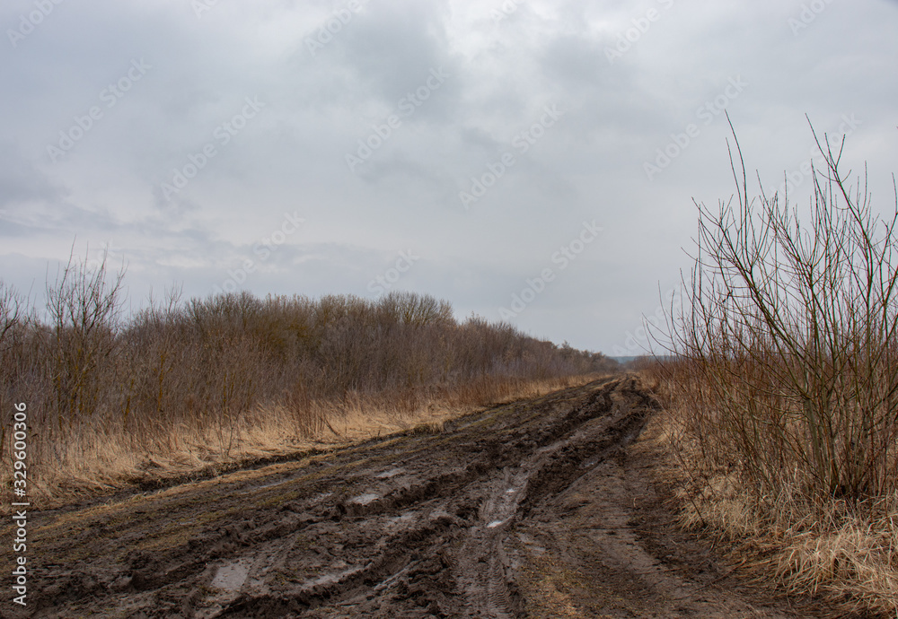 Road in the field, impenetrable dirt and track for off-road 4x4 in bad weather