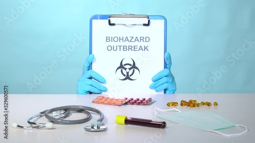 Symbolic scene of doctor in a panic hidden for fear of biohazard outbreak and Coronavirus, Covid-19 disease. Specialist getting in a flap for pandemia, infectious sickness epidemic plague Sars-CoV-2