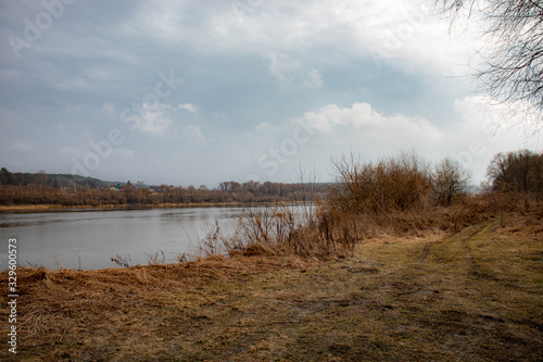View of the Oka River in Russia in the spring in cloudy weather, beautiful river landscape.