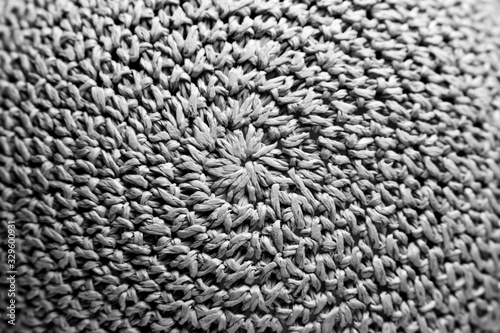 braided hat. texture. background. Black and white photo