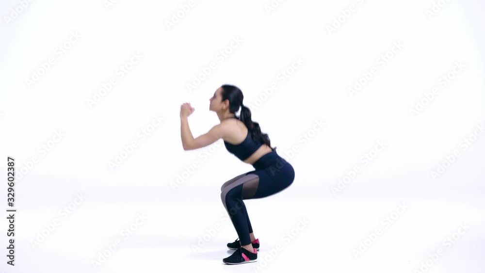 profile of sportswoman doing squat exercise on white profile of sportswoman doing squat exercise on white