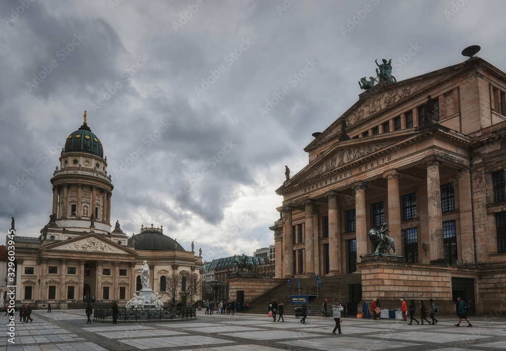 Gendarmenmarkt square in Berlin Germany, with dramatic clouds