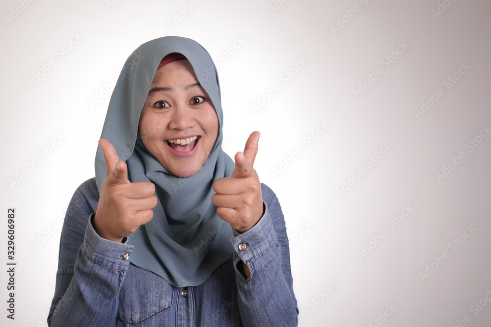 Muslim Woman Pointing Forward to Camera as Choosing You Concept Muslim Woman Pointing Forward to Camera as Choosing You Concept
