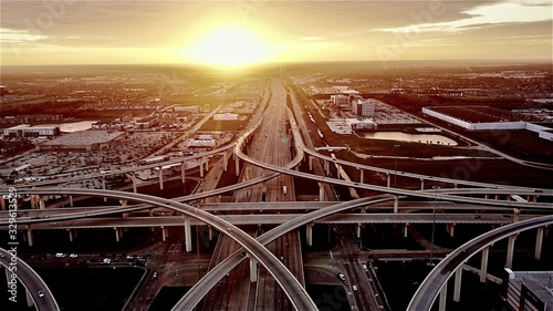 Witness the mesmerizing beauty of a stunning sunset at the intersection of Katy, Texas and the Houston 99 Toll Road Freeway. photo