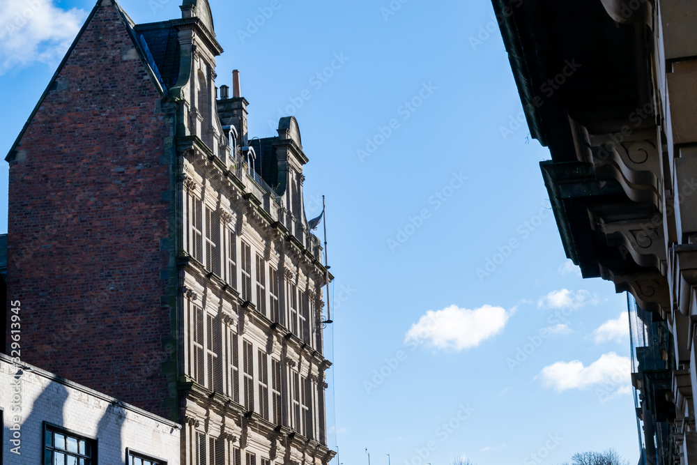 A beautiful old ornate building set against a contrasting blue sky.