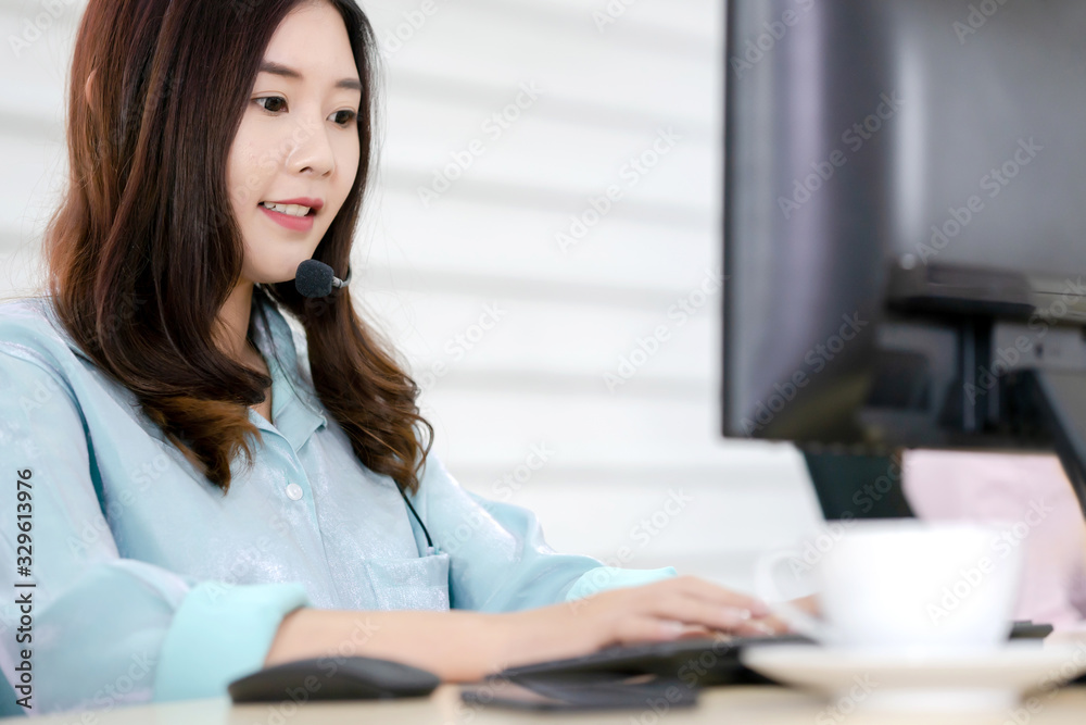 Call center office. Beautiful woman using computer and headset for consulting clients online. Call center office. Beautiful woman using computer and headset for consulting clients online.