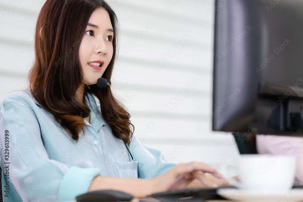 Call center office. Beautiful woman using computer and headset for consulting clients online. Call center office. Beautiful woman using computer and headset for consulting clients online.