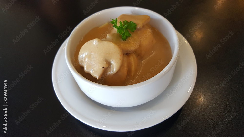 Mushroom soup in a white cup Mushroom soup in a white cup