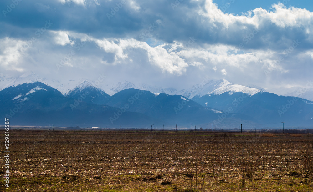 Fototapeta premium Distant mountains with clouds