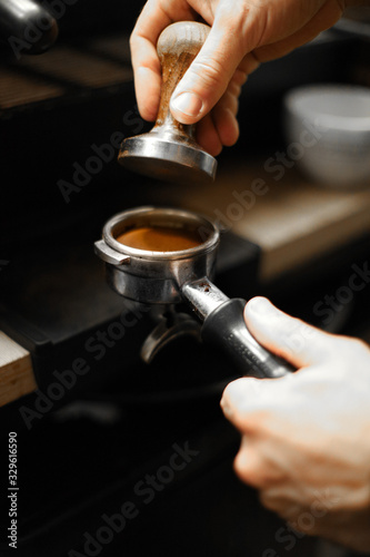 cup of coffee in hands of man