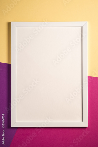 White picture frame with empty template, cream, purple and pink colored background, mockup card