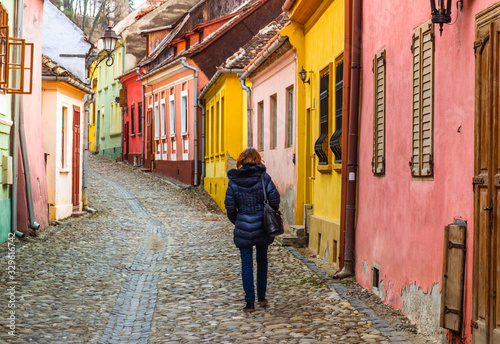 Tourist walking in a street in Sighisoara