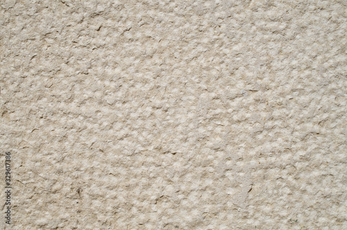 Rough limestone on wall closeup
