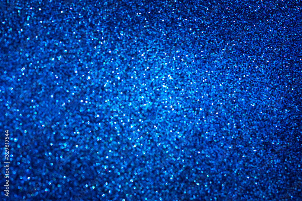 Abstract classic blue blurred background. Glitter festive backdrop. Abstract classic blue blurred background. Glitter festive backdrop.