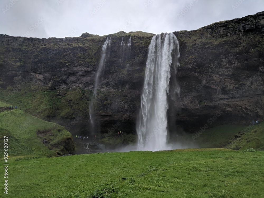 Fototapeta premium Waterfalls, black sand beaches and cliffs