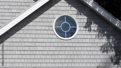 Gray Shake Siding with a Circular Round Window, Gray Siding, White Trim
