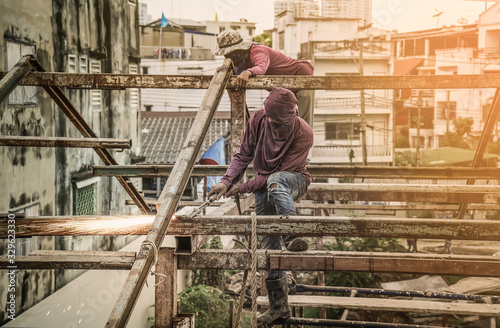 worker man to gas cutting steel in construction site with Oxy-acetylene Cutting Machine