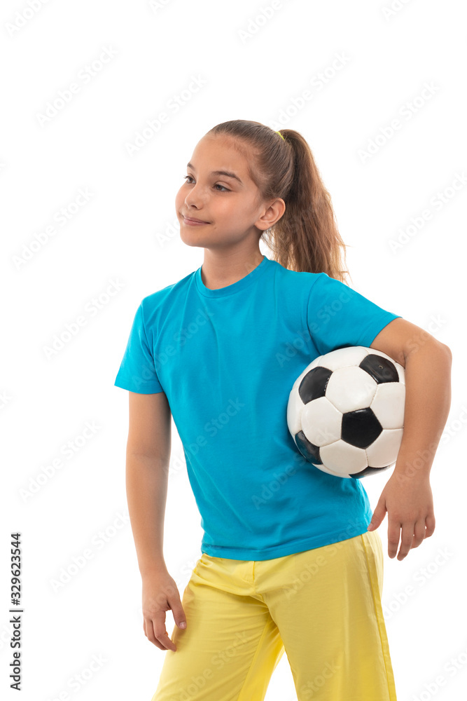 Shot  of a positive smiling girl  standing with ball, isolated