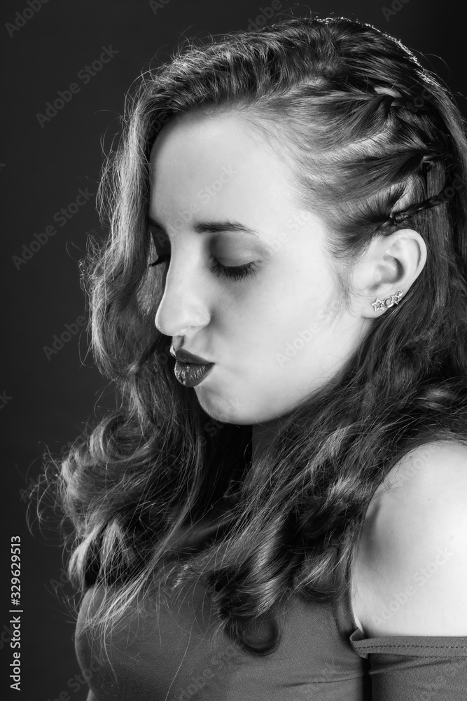 Black and white portrait of an offended but attractive and sweet girl Black and white portrait of an offended but attractive and sweet girl