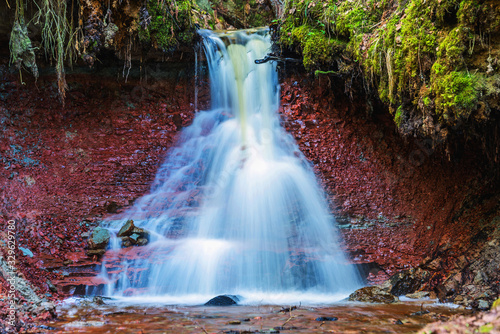 Amazing Zartapu waterfall in the forests of Slitere National park, Latvia (water motion blur) photo