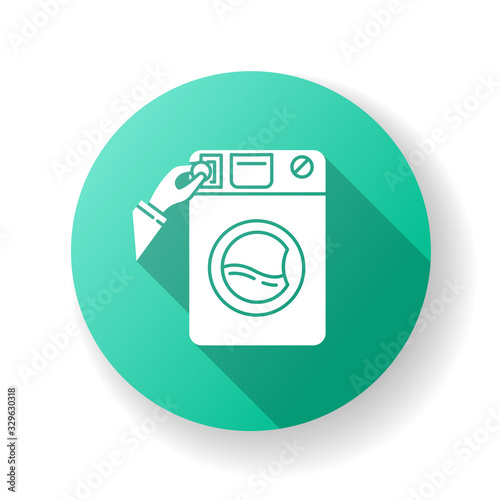 Self-service laundry green flat design long shadow glyph icon. Laundromat, washateria, commercial washer, coin wash service, industrial laundry machine. Silhouette RGB color illustration