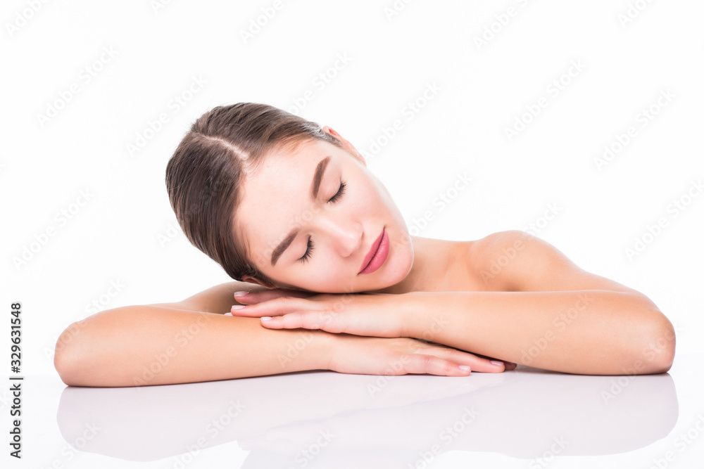 Beautiful woman cares for the skin face posing at studio isolated on white background Beautiful woman cares for the skin face posing at studio isolated on white background