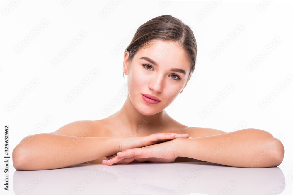 Beauty portrait of a young attractive half naked woman with perfect skin laughing and looking at camera over white background Beauty portrait of a young attractive half naked woman with perfect skin laughing and looking at camera over white background