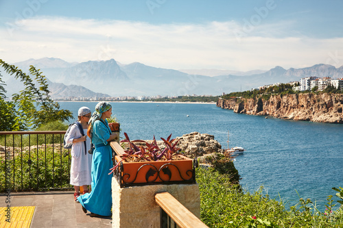 Mom and daughter walking through the streets of Antalya.