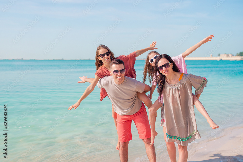 Happy beautiful family on a tropical beach vacation Happy beautiful family on a tropical beach vacation